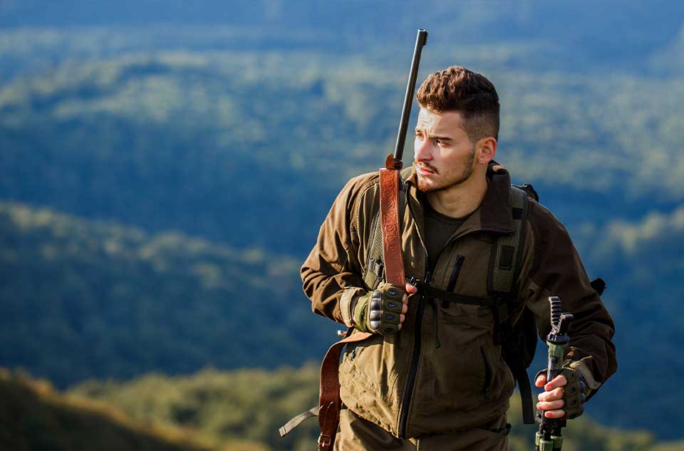 man walking through mountains